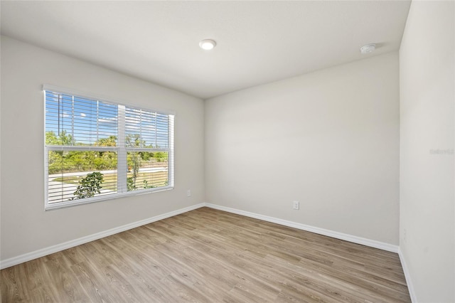 27237 Partin Dr, Punta Gorda, FL 33983 - spare room featuring baseboards, light wood-type flooring, and a smoke detector