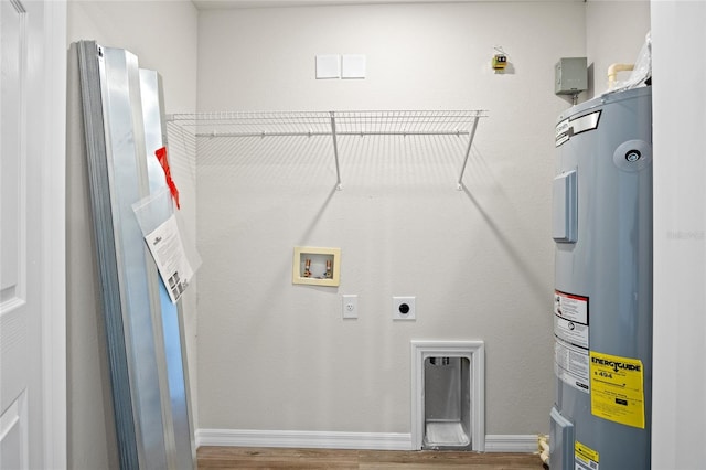 27237 Partin Dr, Punta Gorda, FL 33983 - washroom featuring electric water heater, hookup for an electric dryer, wood finished floors, and hookup for a washing machine