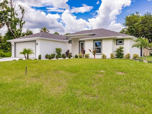 17130 Elder St, Port Charlotte, FL 33954 - view of front facade with an attached garage, stucco siding, a front lawn, and concrete driveway
