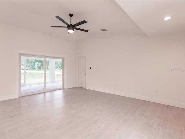 17130 Elder St, Port Charlotte, FL 33954 - empty room with light wood-type flooring, baseboards, ceiling fan, recessed lighting, and lofted ceiling