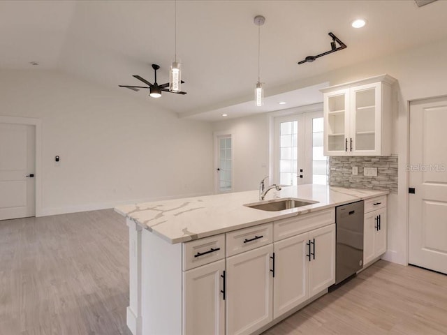17130 Elder St, Port Charlotte, FL 33954 - kitchen with dishwasher, a peninsula, a sink, a ceiling fan, and white cabinets