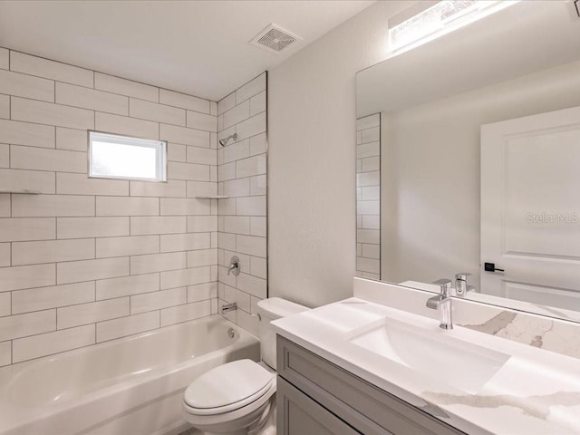 17130 Elder St, Port Charlotte, FL 33954 - full bathroom with toilet, vanity, and shower / bath combination