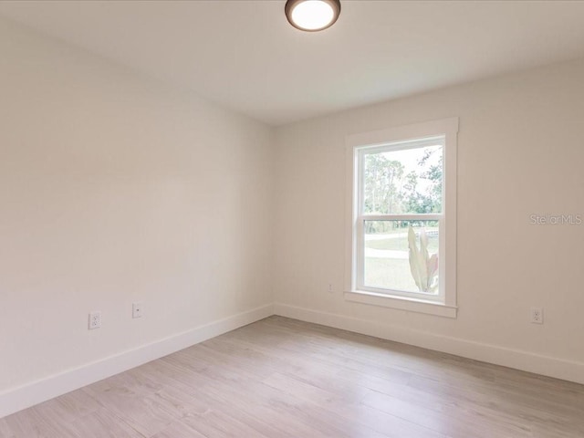 17130 Elder St, Port Charlotte, FL 33954 - spare room with baseboards and light wood-type flooring
