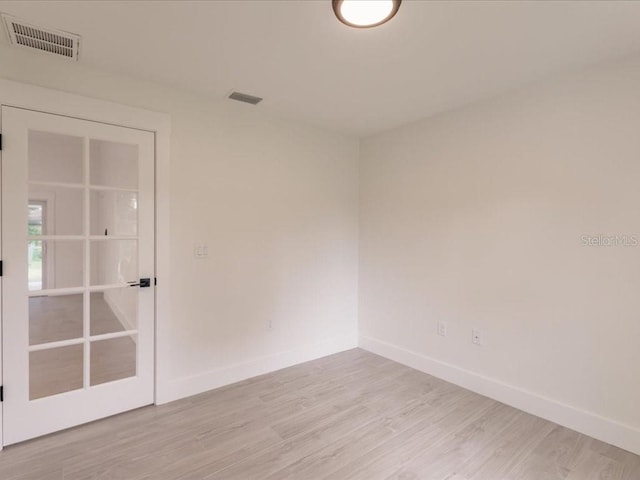17130 Elder St, Port Charlotte, FL 33954 - spare room featuring baseboards and light wood-style flooring