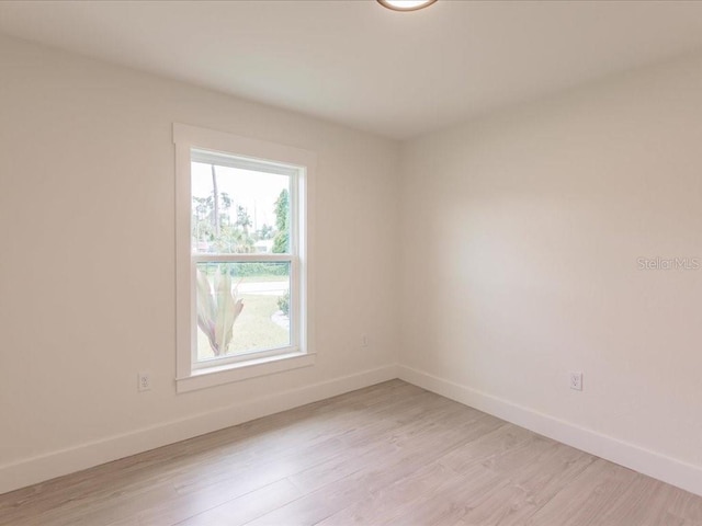 17130 Elder St, Port Charlotte, FL 33954 - spare room with baseboards and light wood finished floors