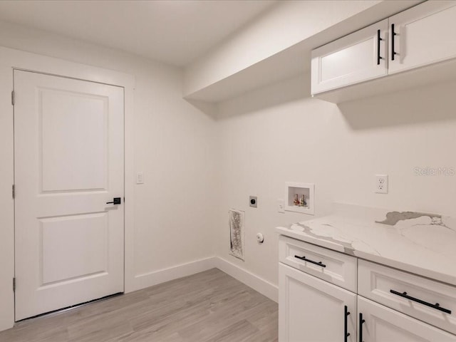 17130 Elder St, Port Charlotte, FL 33954 - laundry room with hookup for an electric dryer, hookup for a gas dryer, light wood finished floors, washer hookup, and baseboards