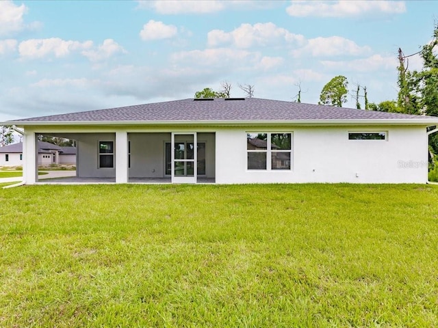 17130 Elder St, Port Charlotte, FL 33954 - rear view of property with stucco siding, a yard, and a patio area