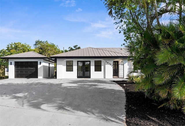 19723 Midway Blvd, Port Charlotte, FL 33948 - view of front facade featuring french doors, stucco siding, and an outbuilding
