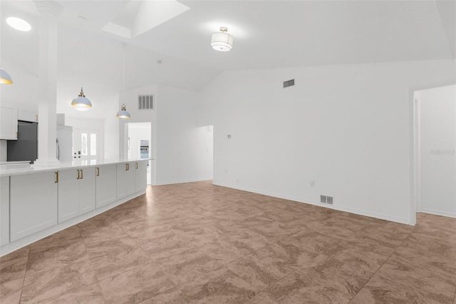19723 Midway Blvd, Port Charlotte, FL 33948 - unfurnished living room with high vaulted ceiling and baseboards