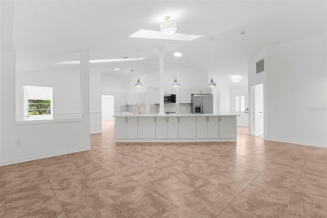 19723 Midway Blvd, Port Charlotte, FL 33948 - unfurnished living room featuring a skylight, high vaulted ceiling, and baseboards