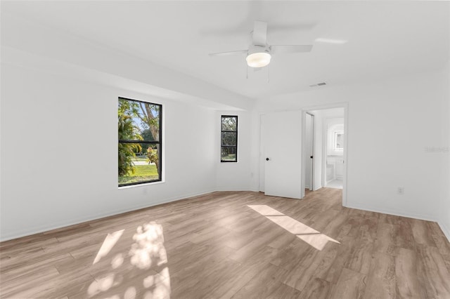 19723 Midway Blvd, Port Charlotte, FL 33948 - unfurnished bedroom with light wood-type flooring, ensuite bathroom, baseboards, and a ceiling fan