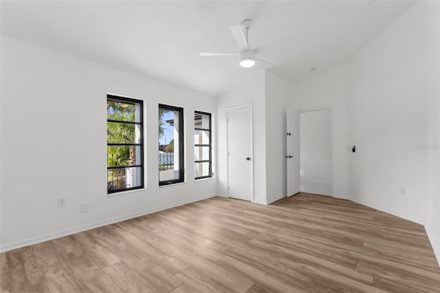 19723 Midway Blvd, Port Charlotte, FL 33948 - empty room with lofted ceiling, light wood-type flooring, a ceiling fan, and baseboards
