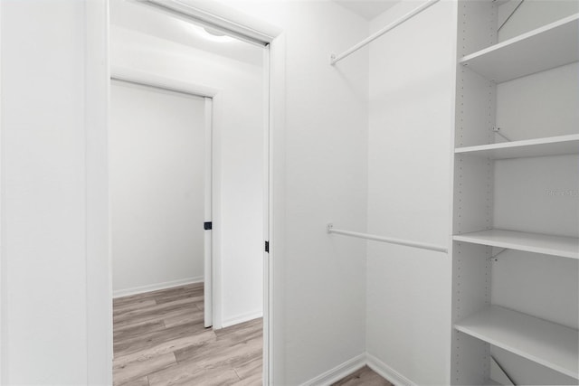 19723 Midway Blvd, Port Charlotte, FL 33948 - spacious closet featuring wood finished floors