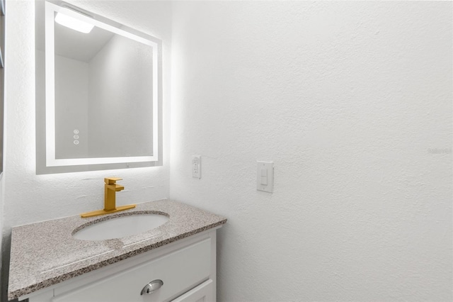 19723 Midway Blvd, Port Charlotte, FL 33948 - bathroom with vanity and a textured wall