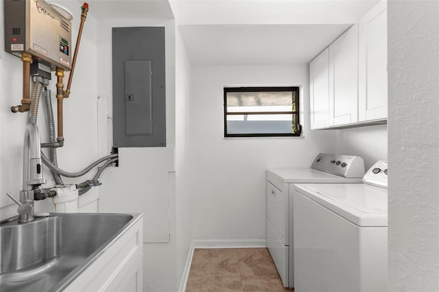 19723 Midway Blvd, Port Charlotte, FL 33948 - washroom with cabinet space, electric panel, washing machine and clothes dryer, baseboards, and light tile patterned flooring
