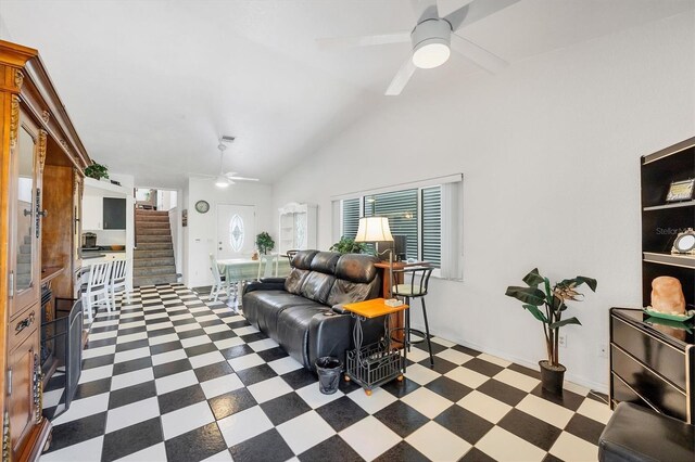 3105/3109 Vasco St, Punta Gorda, FL 33950 - living area featuring ceiling fan, tile patterned floors, lofted ceiling, and stairs