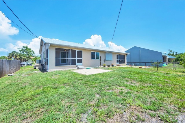 3105/3109 Vasco St, Punta Gorda, FL 33950 - back of house with a sunroom, stucco siding, and a patio