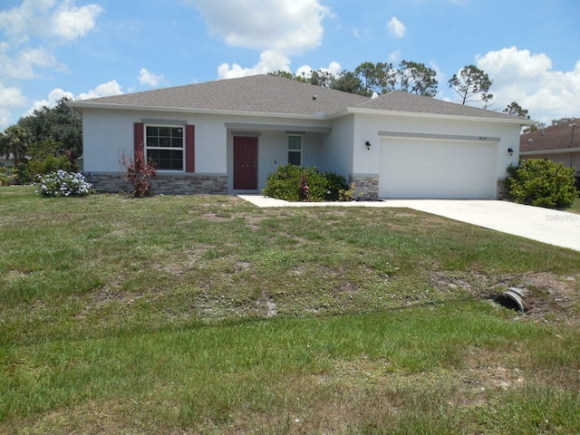 4830 Cazes Ave, North Port, FL 34287 - single story home featuring stucco siding, stone siding, and a garage