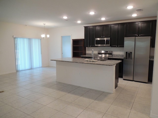 4830 Cazes Ave, North Port, FL 34287 - kitchen with stainless steel appliances, a sink, light tile patterned flooring, light stone countertops, and recessed lighting