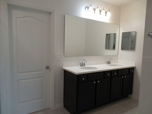 4830 Cazes Ave, North Port, FL 34287 - full bath with double vanity, tile patterned floors, and baseboards
