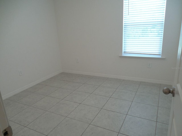 4830 Cazes Ave, North Port, FL 34287 - spare room with light tile patterned floors and baseboards