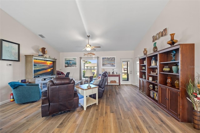 16094 Ortega Dr, Punta Gorda, FL 33955 - living room featuring vaulted ceiling, light wood-style flooring, ceiling fan, and baseboards