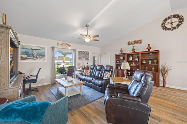 16094 Ortega Dr, Punta Gorda, FL 33955 - living room featuring lofted ceiling, a ceiling fan, light wood-style flooring, and baseboards