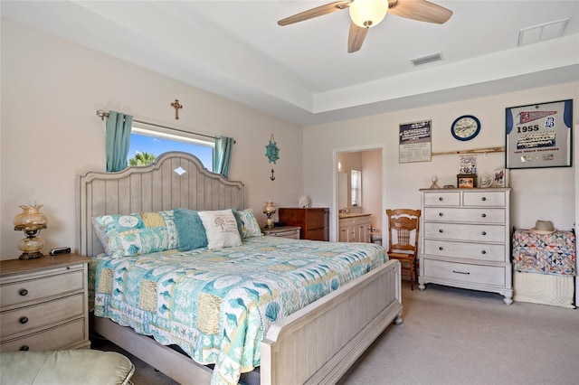 16094 Ortega Dr, Punta Gorda, FL 33955 - bedroom with light colored carpet, ensuite bath, and a ceiling fan