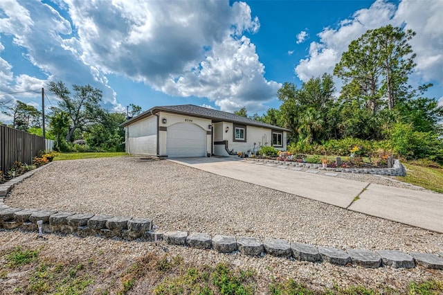 4044 S Salford Blvd, North Port, FL 34287 - ranch-style house with concrete driveway, a garage, and stucco siding