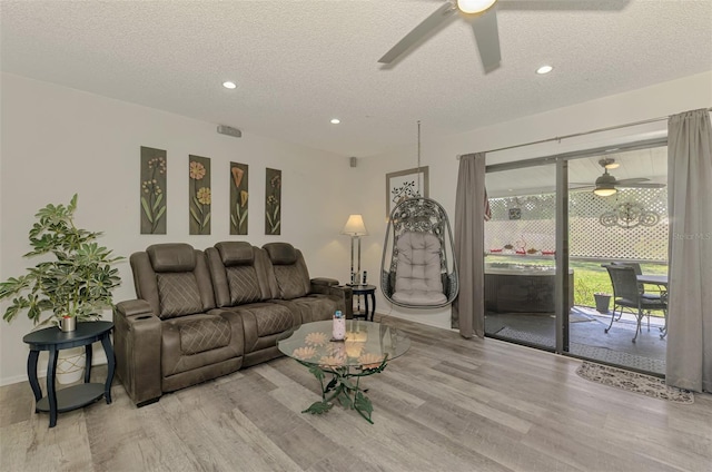 4044 S Salford Blvd, North Port, FL 34287 - living room featuring ceiling fan, light wood finished floors, recessed lighting, a textured ceiling, and baseboards