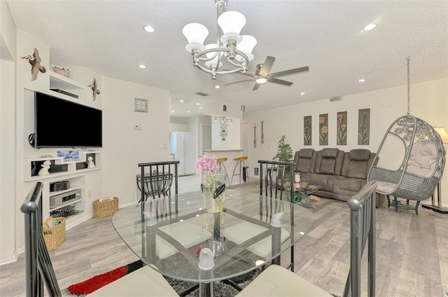 4044 S Salford Blvd, North Port, FL 34287 - dining area with a chandelier, light wood-style floors, a textured ceiling, recessed lighting, and ceiling fan