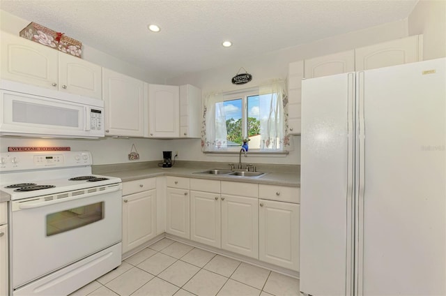 4044 S Salford Blvd, North Port, FL 34287 - kitchen with white appliances, a sink, light tile patterned floors, recessed lighting, and a textured ceiling