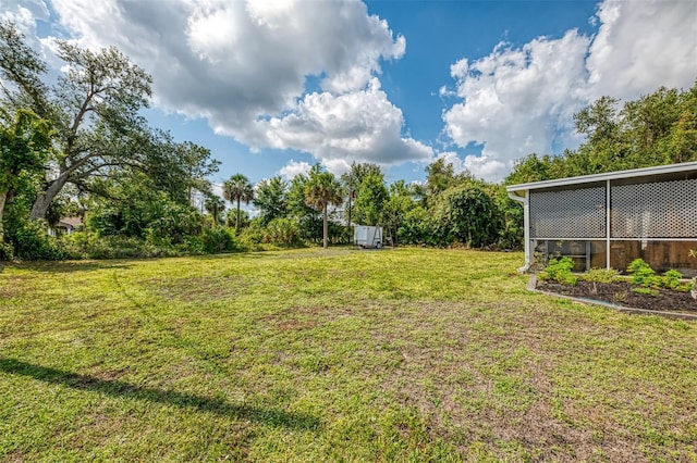 4044 S Salford Blvd, North Port, FL 34287 - view of green lawn featuring an outdoor structure
