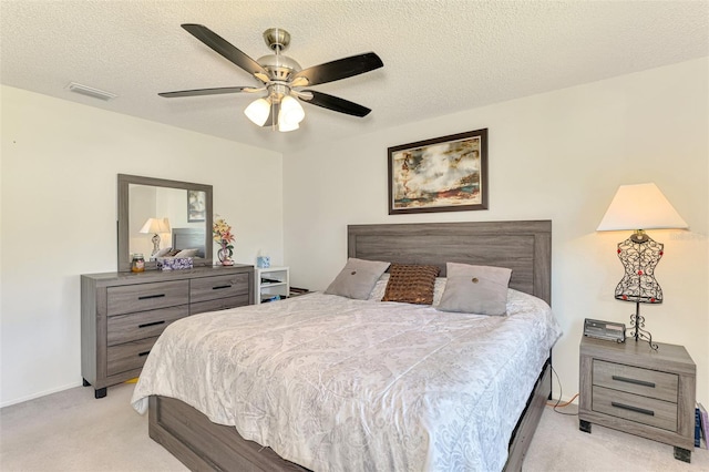 4044 S Salford Blvd, North Port, FL 34287 - bedroom with light colored carpet, a textured ceiling, ceiling fan, and baseboards