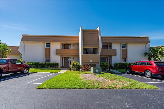 1080 Bal Harbor Blvd Unit 12C, Punta Gorda, FL 33950 - view of property featuring uncovered parking