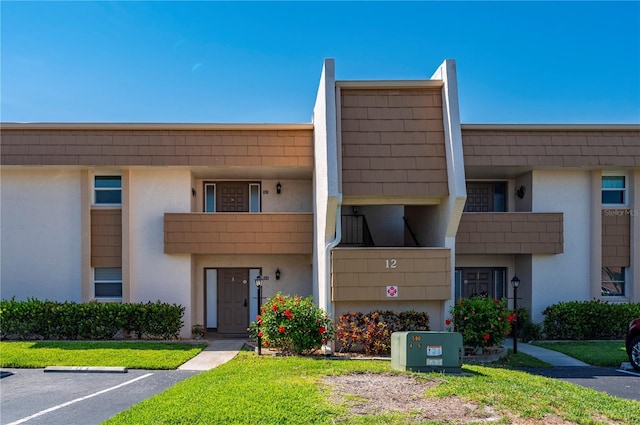 1080 Bal Harbor Blvd Unit 12C, Punta Gorda, FL 33950 - view of building exterior with uncovered parking