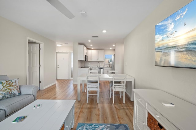 1080 Bal Harbor Blvd Unit 12C, Punta Gorda, FL 33950 - living area with light wood-style flooring, recessed lighting, baseboards, and ceiling fan