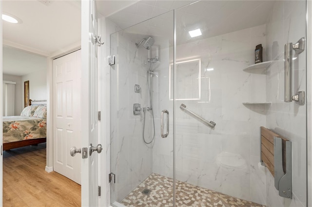 1080 Bal Harbor Blvd Unit 12C, Punta Gorda, FL 33950 - full bath featuring connected bathroom, a marble finish shower, and wood finished floors