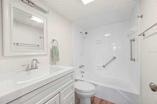 1080 Bal Harbor Blvd Unit 12C, Punta Gorda, FL 33950 - bathroom with vanity, toilet, washtub / shower combination, and wood finished floors