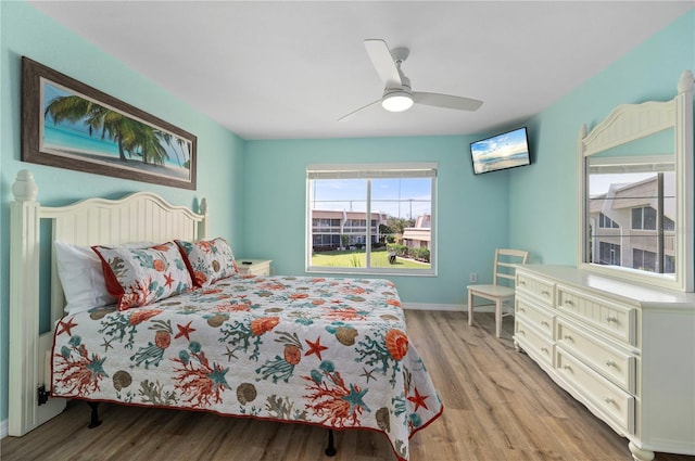 1080 Bal Harbor Blvd Unit 12C, Punta Gorda, FL 33950 - bedroom featuring light wood-type flooring, baseboards, and ceiling fan