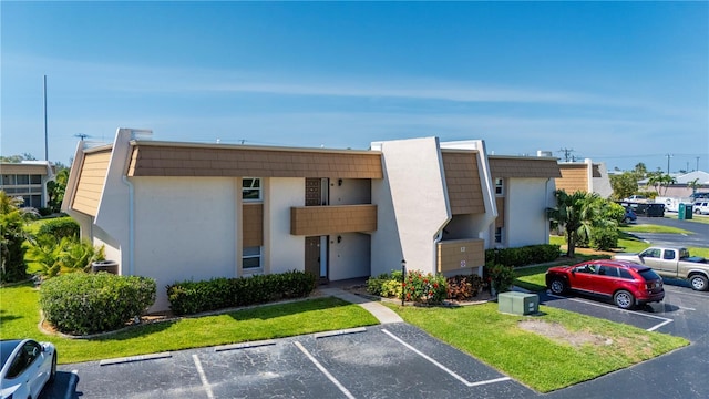 1080 Bal Harbor Blvd Unit 12C, Punta Gorda, FL 33950 - view of building exterior with uncovered parking