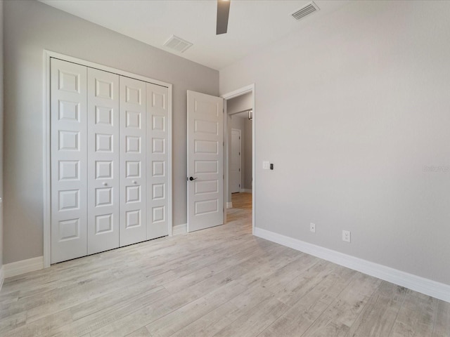 223 Australian Dr, Rotonda West, FL 33947 - unfurnished bedroom with light wood finished floors, a closet, and baseboards