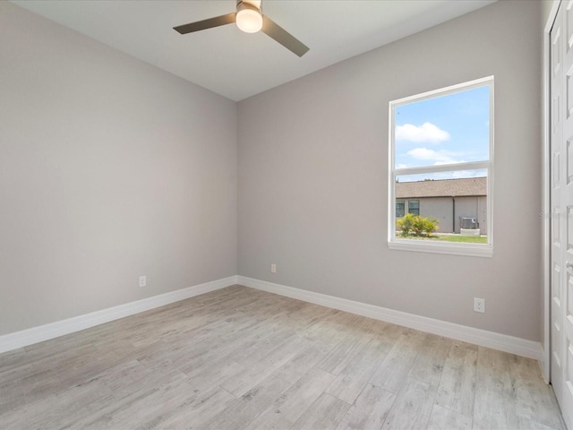 223 Australian Dr, Rotonda West, FL 33947 - unfurnished room with ceiling fan, light wood-type flooring, and baseboards