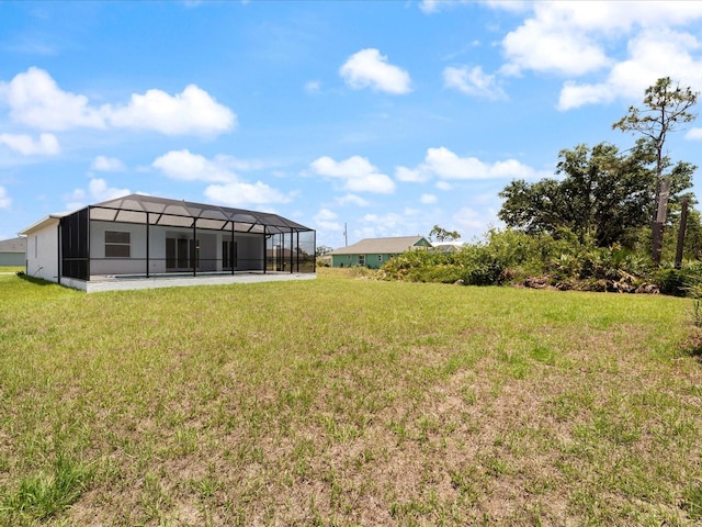 223 Australian Dr, Rotonda West, FL 33947 - view of green lawn featuring glass enclosure