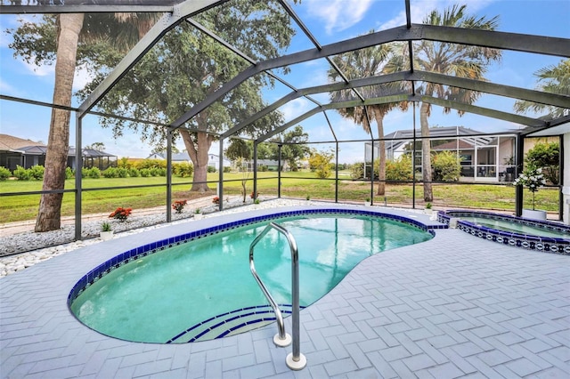 2442 Rio De Janeiro Ave, Punta Gorda, FL 33983 - view of swimming pool with a pool with connected hot tub, a lanai, a patio, and a yard