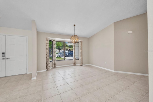 2442 Rio De Janeiro Ave, Punta Gorda, FL 33983 - spare room with a chandelier, light tile patterned flooring, and baseboards