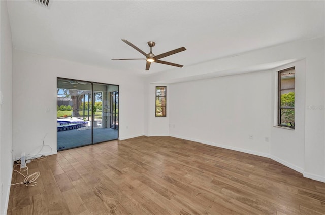 2442 Rio De Janeiro Ave, Punta Gorda, FL 33983 - unfurnished room featuring wood finished floors, ceiling fan, and baseboards