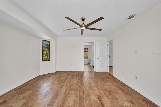 2442 Rio De Janeiro Ave, Punta Gorda, FL 33983 - empty room with ceiling fan, light wood-style floors, and baseboards