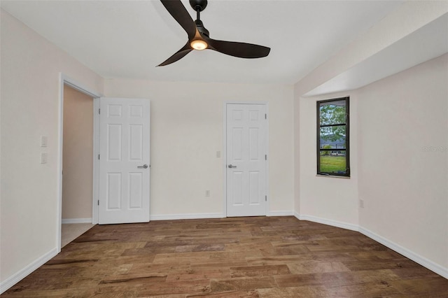 2442 Rio De Janeiro Ave, Punta Gorda, FL 33983 - empty room with a ceiling fan, wood finished floors, and baseboards