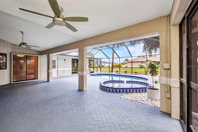 2442 Rio De Janeiro Ave, Punta Gorda, FL 33983 - view of patio featuring ceiling fan, a pool with connected hot tub, and glass enclosure